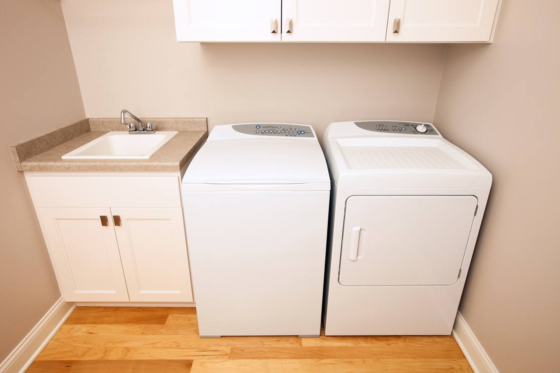 New House Laundry Room with Conventional Washer and Dryer